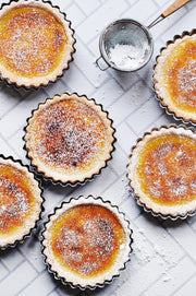 Chevron Tile Replica Photography Backdrop with bruleed tarts in tart pans