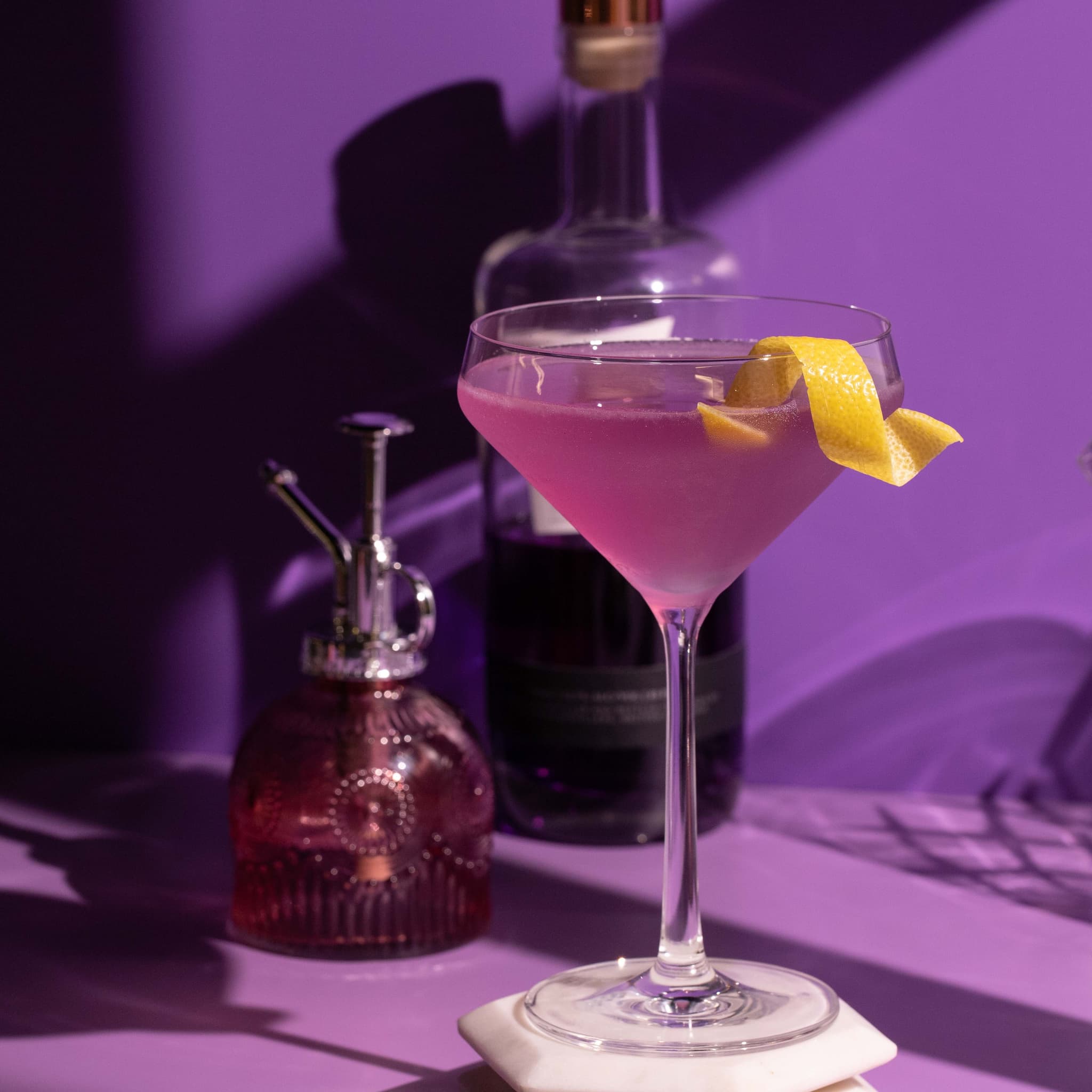 Cocktail on lavender rollup with window shadows