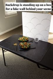 Two salads on plates with a Scalloped Tiles Replica Photography Backdrop behind the scenes