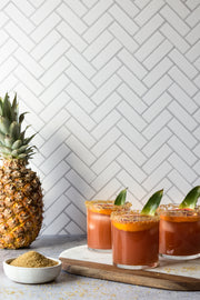 Chevron Tile Replica Photography Backdrop with pineapple drinks and a pineapple