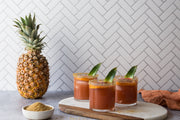 Chevron Tile Replica Photography Backdrop with pineapple drinks and a whole pineapple