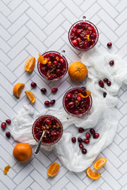 Chevron Tile Replica Photography Backdrop with cranberry sauce in bowls and oranges