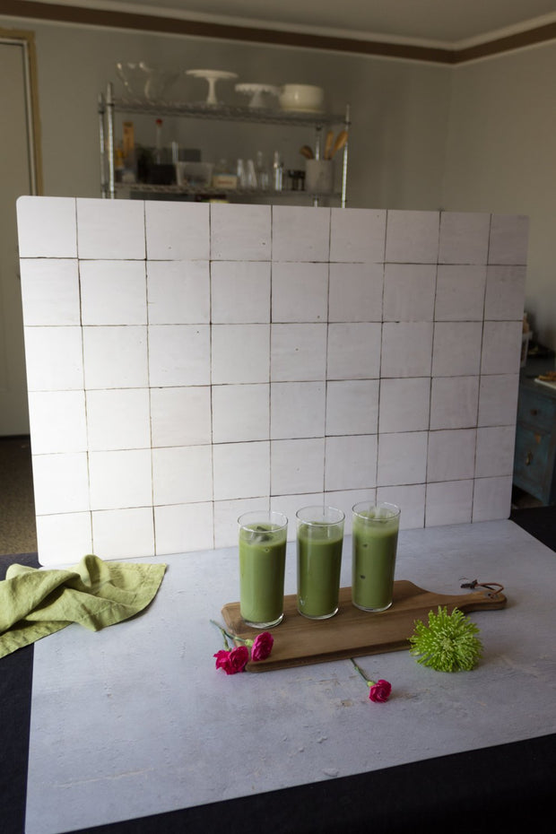 Green smoothies in glasses with a Moroccan Tile Replica Photography Backdrop 