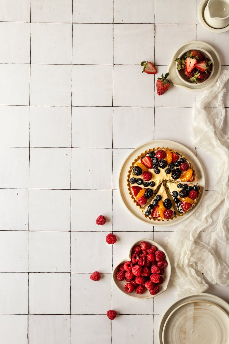 Fruit tart with raspberries and strawberries on a Super-Thin & pliable Moroccan Tile Replica Photography Backdrop 