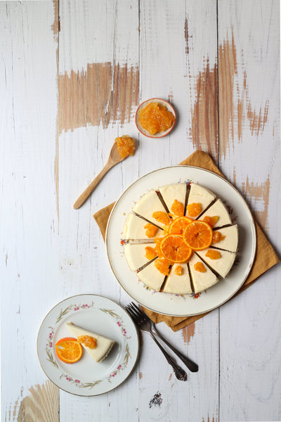Super-Thin & Pliable Whitewashed Reclaimed Wood Replica Photography Backdrop 2 ft x 3 ft, Lightweight, Moisture & Stain-Resistant with cheesecake and oranges