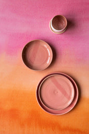 Pink and Orange ombre backdrop with pottery
