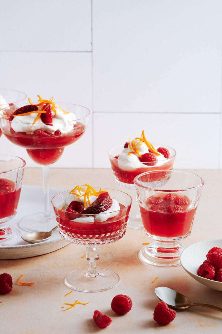 Glasses of red jelly with whipped cream and oranges with the Super-Thin & Pliable Creamy White Tile Replica Photography Backdrop