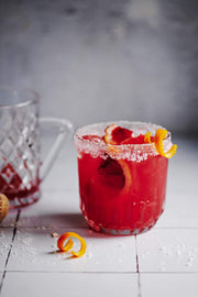 Moroccan red drink in a glass on a Super-Thin & pliable Moroccan Tile Replica Photography Backdrop 2 ft x 3ft board
