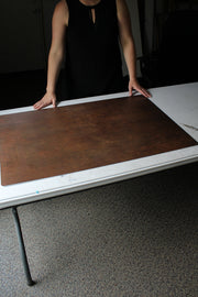Rusty Metal Photography Backdrop 2 ft x 3ft board with a person holding it up