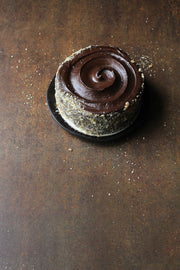 Rusty Metal Photography Backdrop 2 ft x 3ft board with a chocolate cake on a plate
