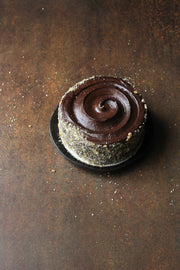 Rusty Metal Photography Backdrop 2 ft x 3ft board with a whole chocolate cake