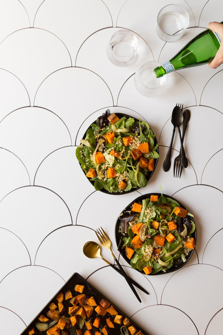 Squash salad and sparkling water in glasses on a Scalloped Tiles Replica Photography Backdrop