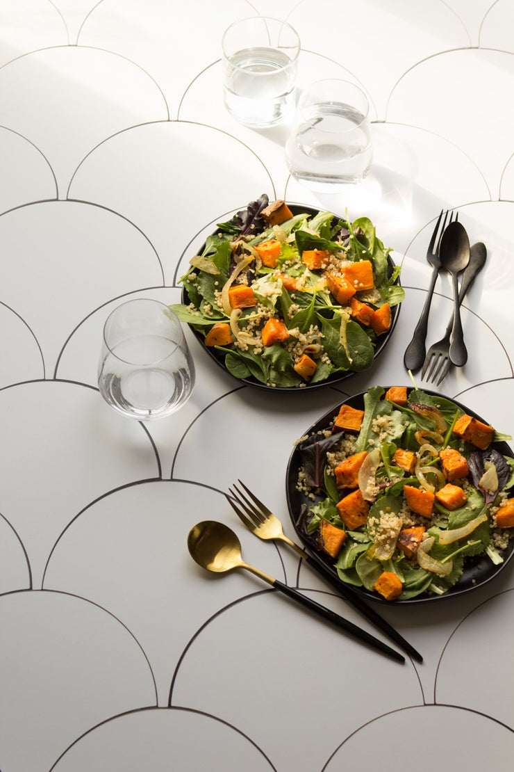 Two squash salads on plates on a Scalloped Tiles Replica Photography Backdrop