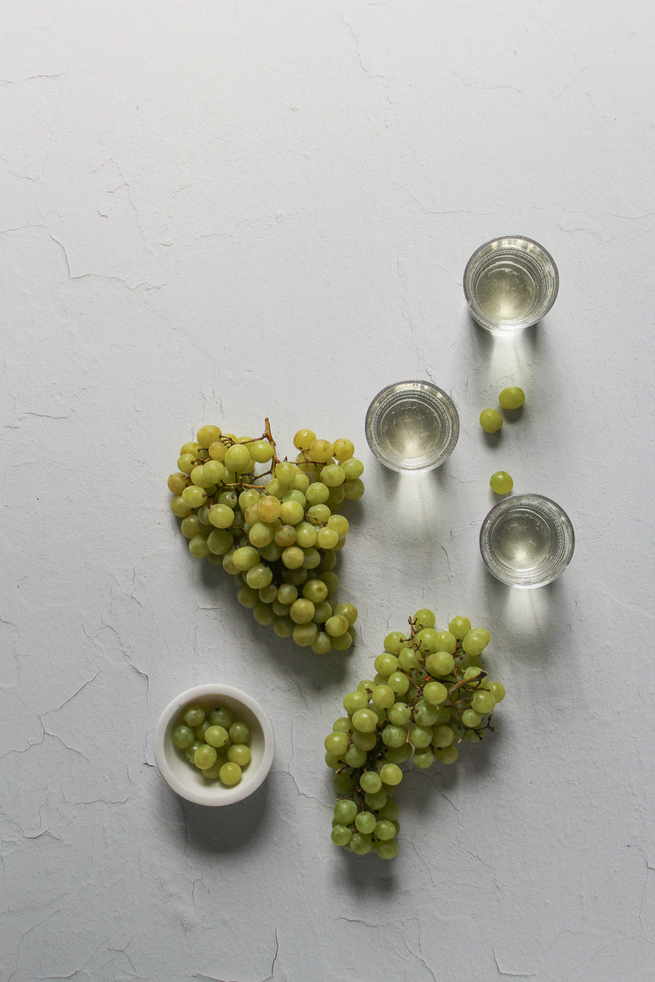 Super-Thin & Pliable Simple White Textured Photography Backdrop 2 ft x 3 ft, Lightweight, Moisture & Stain Resistant with green grapes and wine