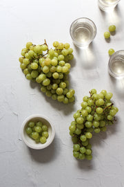 Super-Thin & Pliable Simple White Textured Photography Backdrop 2 ft x 3 ft, Lightweight, Moisture & Stain Resistant with wine and grapes