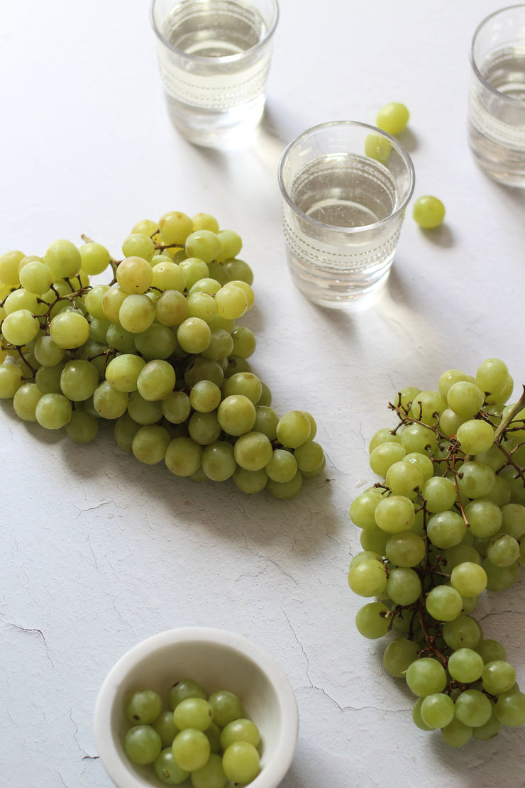 Super-Thin & Pliable Simple White Textured Photography Backdrop 2 ft x 3 ft, Lightweight, Moisture & Stain Resistant with green grapes