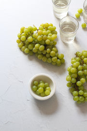 Simple White Textured Photography Backdrop 2 ft x 3 ft with grapes and glasses of wine