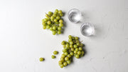 Super-Thin & Pliable Simple White Textured Photography Backdrop 2 ft x 3 ft, Lightweight, Moisture & Stain Resistant with glasses and grapes