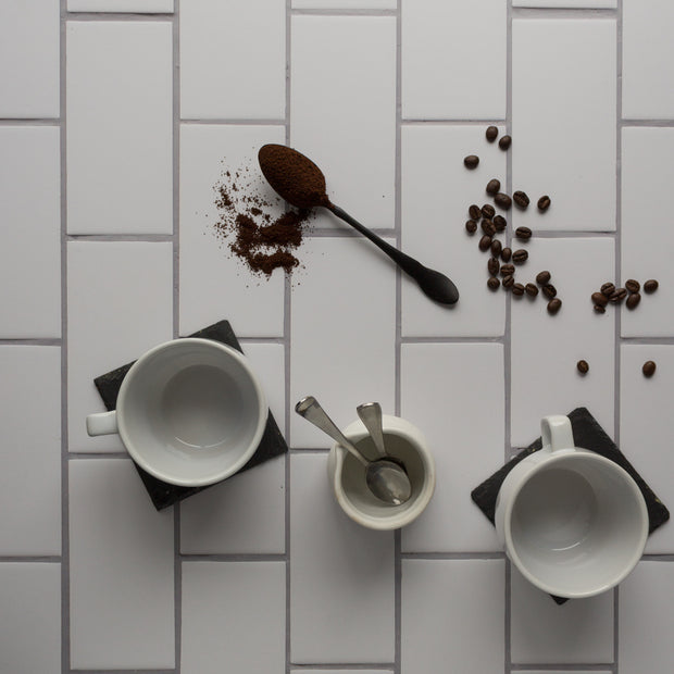20-inch x 20-inch The Most Realistic Subway Tile Photography Backdrop 3 mm thick Physical Board, Lightweight, Moisture & Stain-Resistant with coffee cups, coffee creamer, and coffee beans