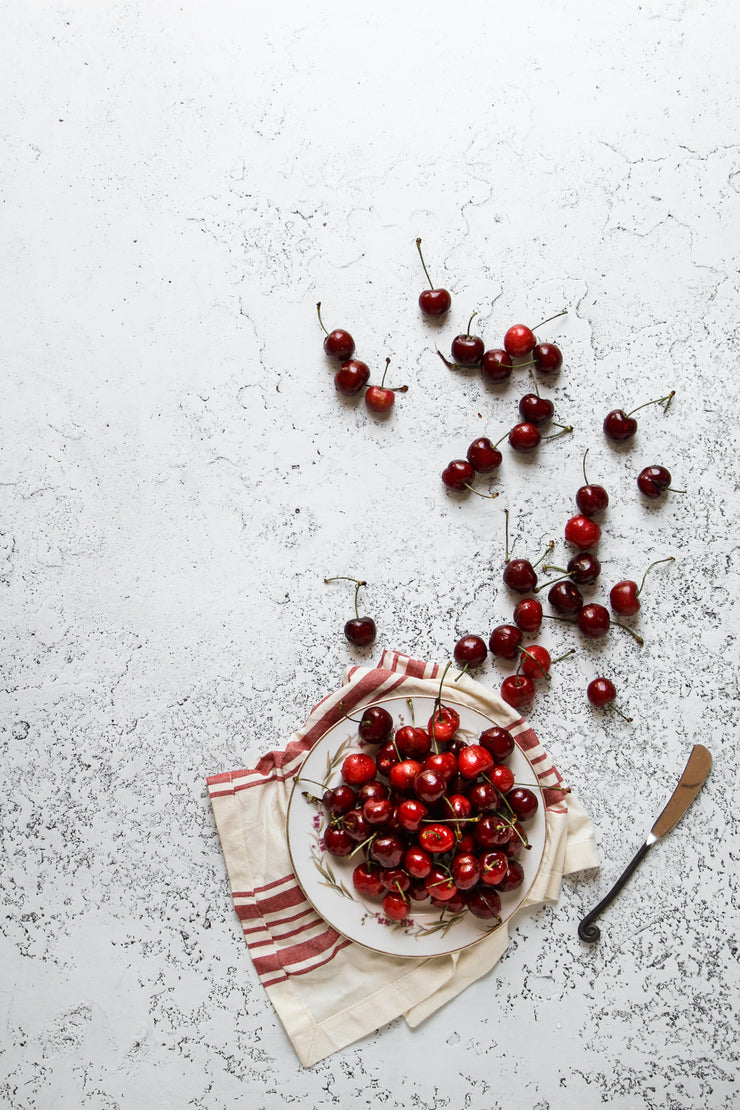 White Plaster Photography Backdrop 2 ft x 3 ft | 3 mm thick with fresh cherries on a plate