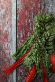 Aged Red Reclaimed Barn Wood Photography Backdrop 2 ft x 3ft board | 3 mm thick with Swiss chard up close